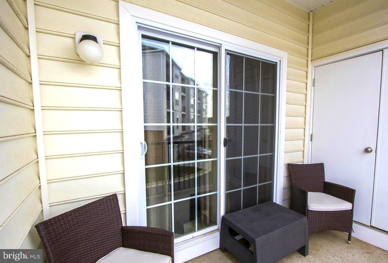 43132 Thoroughfare Gap Terrace Ashburn, VA 20148 - Photo 18 of 18 a view of a room with furniture and wooden floor