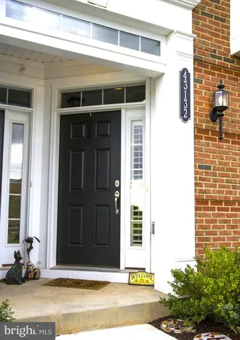 a view of brick building with a window and a door