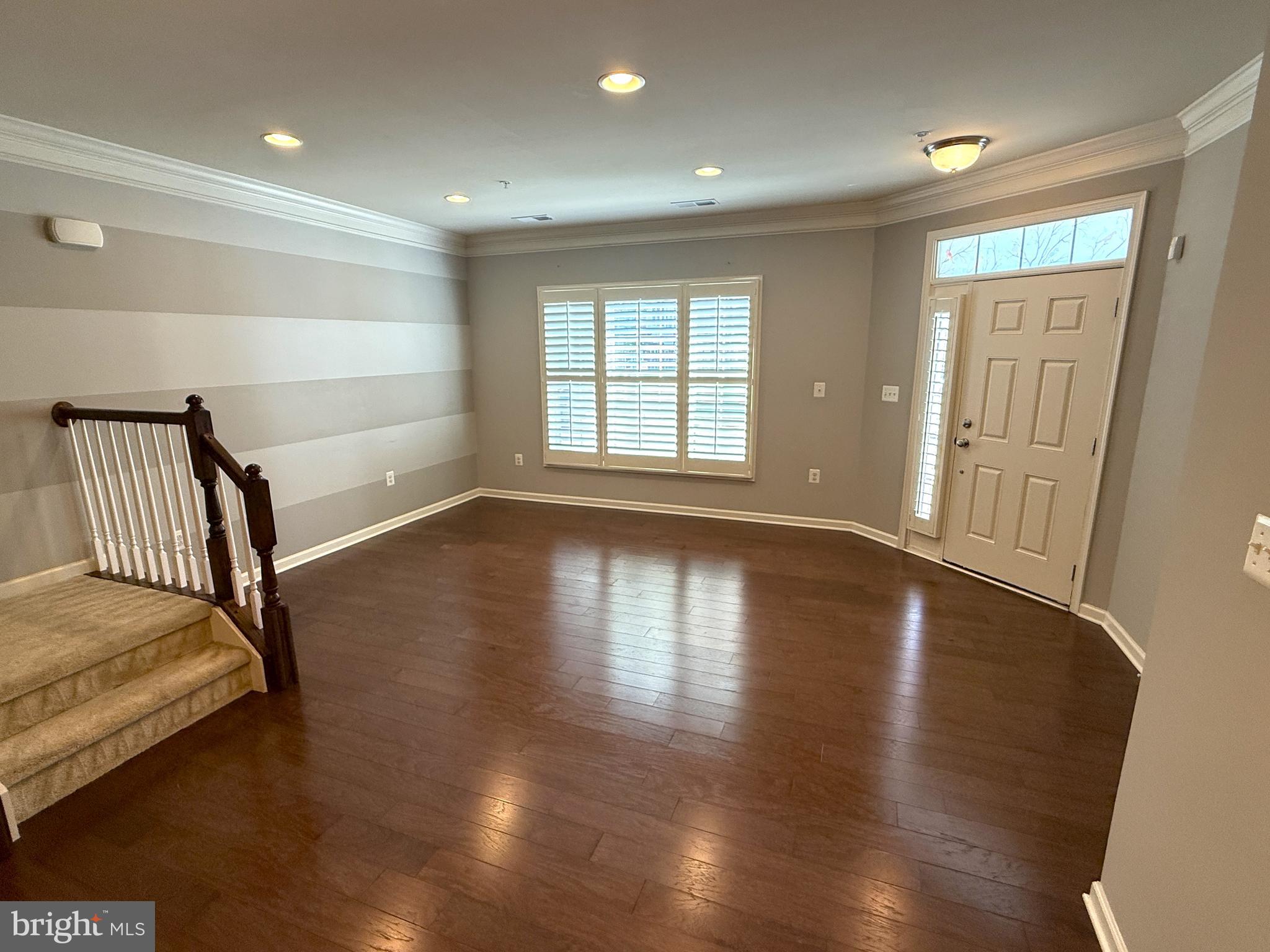 43132 Thoroughfare Gap Terrace Ashburn, VA 20148 - Photo 4 of 18 a view of a bedroom with wooden floor and a window