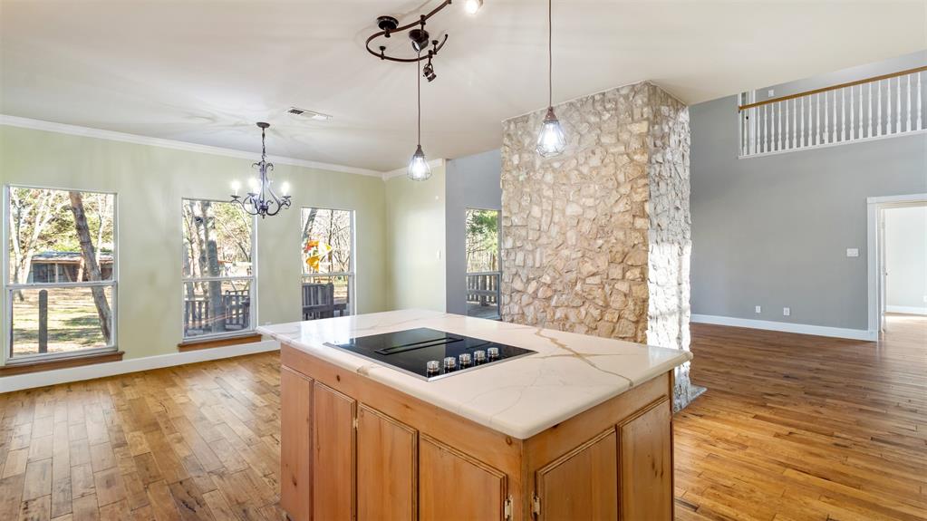 431 Genoa Court Princeton, TX 75407 - Photo 19 of 39 a kitchen that has a table and chairs in it