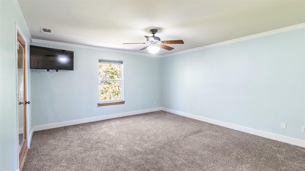 431 Genoa Court Princeton, TX 75407 - Photo 23 of 39 an empty room with windows and fan