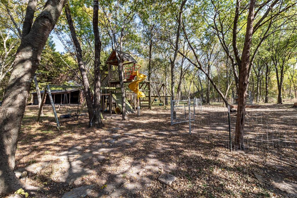 431 Genoa Court Princeton, TX 75407 - Photo 35 of 39 a view of a yard with trees