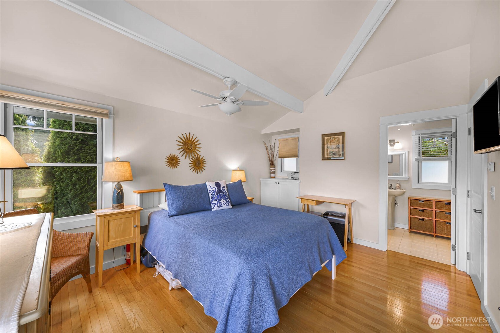 15485 Northeast Peterson Road Keyport, WA 98345 - Photo 15 of 39 a bedroom with a bed and wooden floor