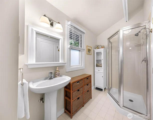 a bathroom with a sink double vanity and a mirror