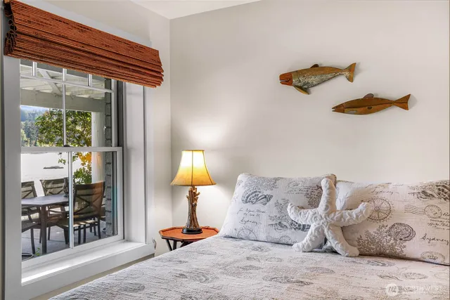 a bed room with a bed and a lamp