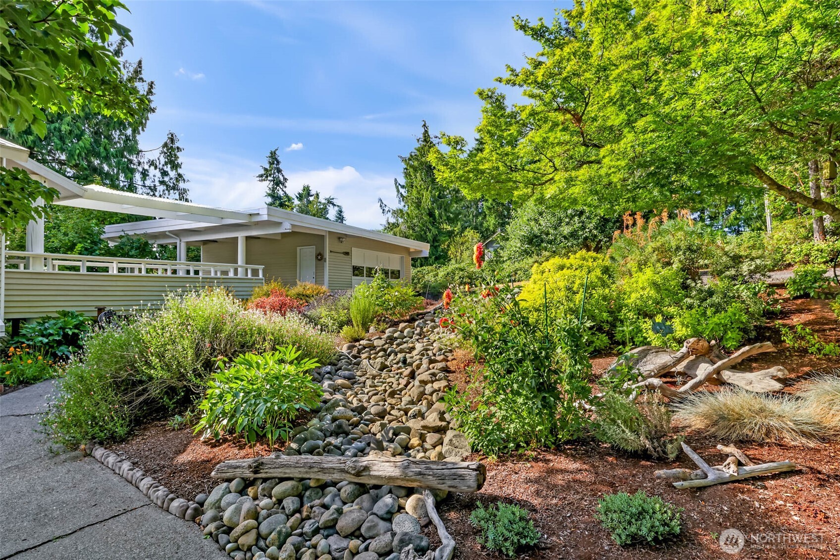 15485 Northeast Peterson Road Keyport, WA 98345 - Photo 29 of 39 a view of a garden with a patio