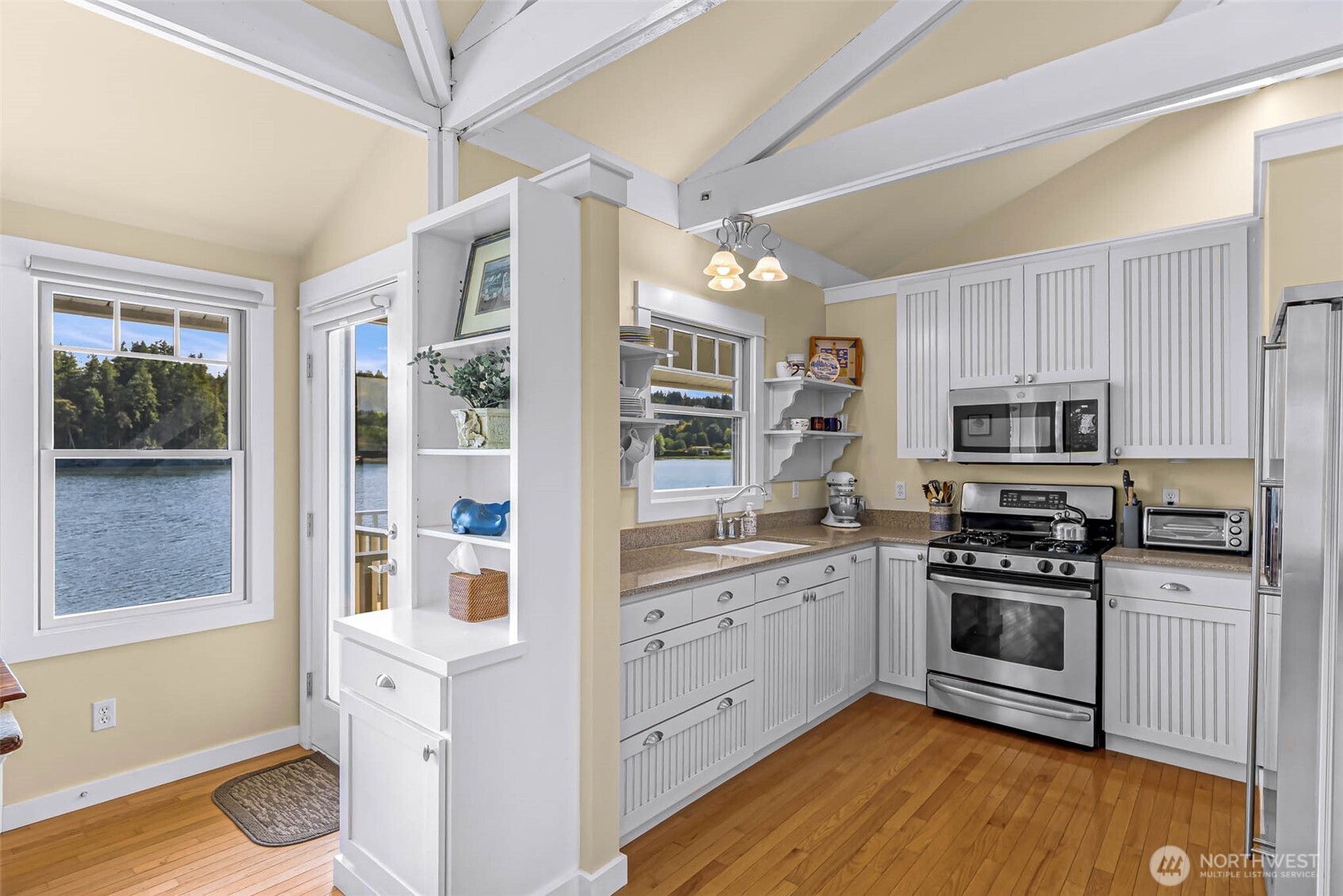 15485 Northeast Peterson Road Keyport, WA 98345 - Photo 9 of 39 a kitchen with stainless steel appliances granite countertop a stove and a refrigerator