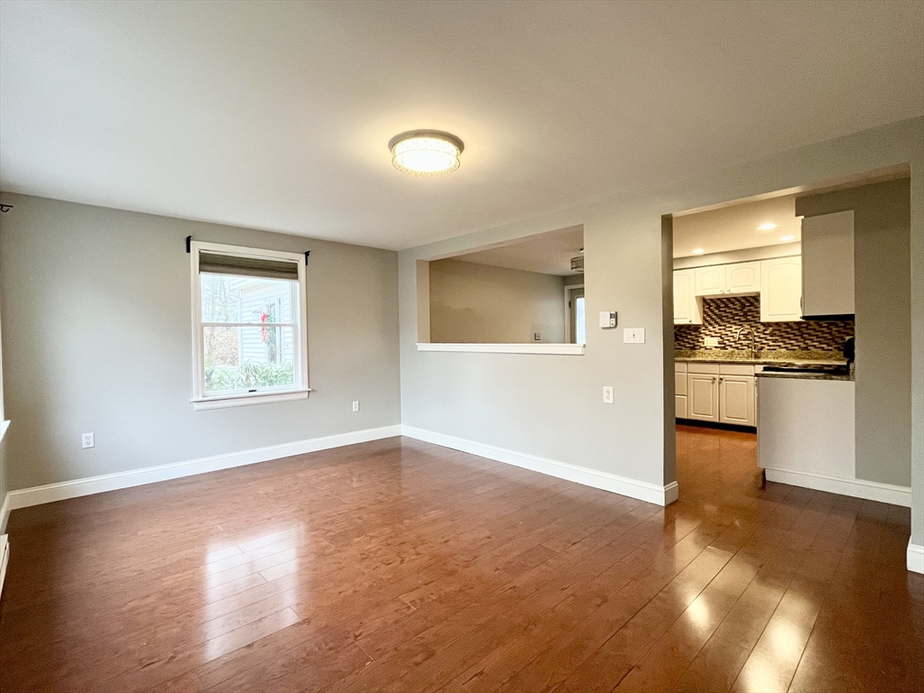 11 Jones Landing, Unit B Walpole, MA 02081 - Photo 3 of 18 wooden floor in an empty room with a window