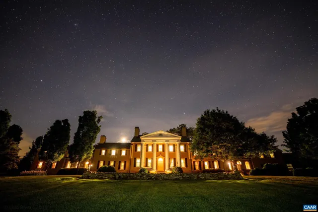 a view of a livingroom with furniture window and wooden floor
