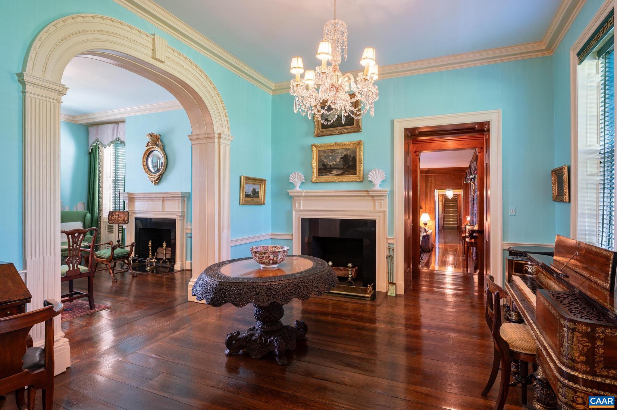21515 Trappe Road Upperville, VA 20184 - Photo 17 of 75 a living room with furniture a fireplace and a chandelier