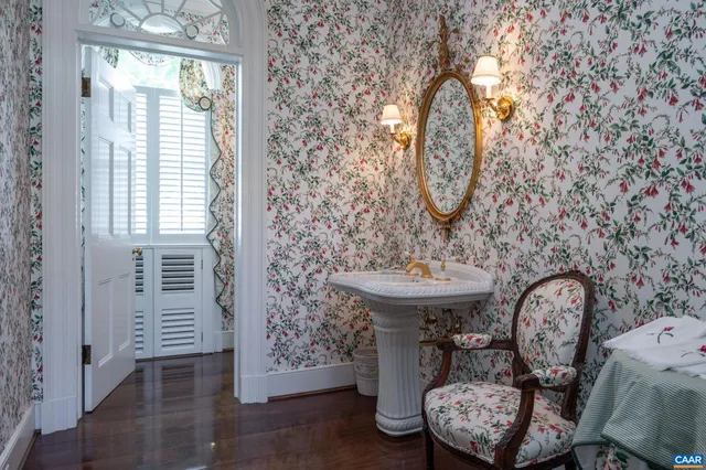 a dining room with furniture a chandelier and a rug