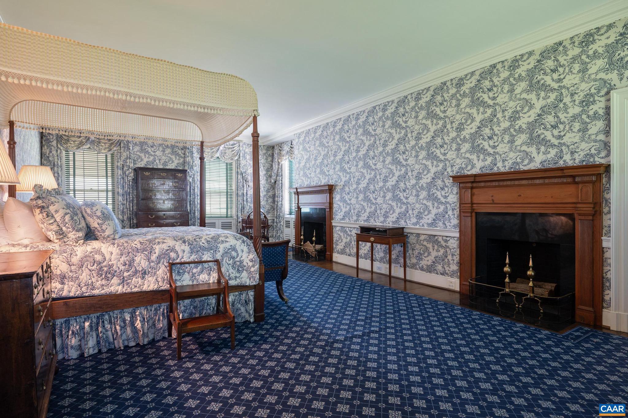 21515 Trappe Road Upperville, VA 20184 - Photo 25 of 75 a bedroom with a bed and a fireplace