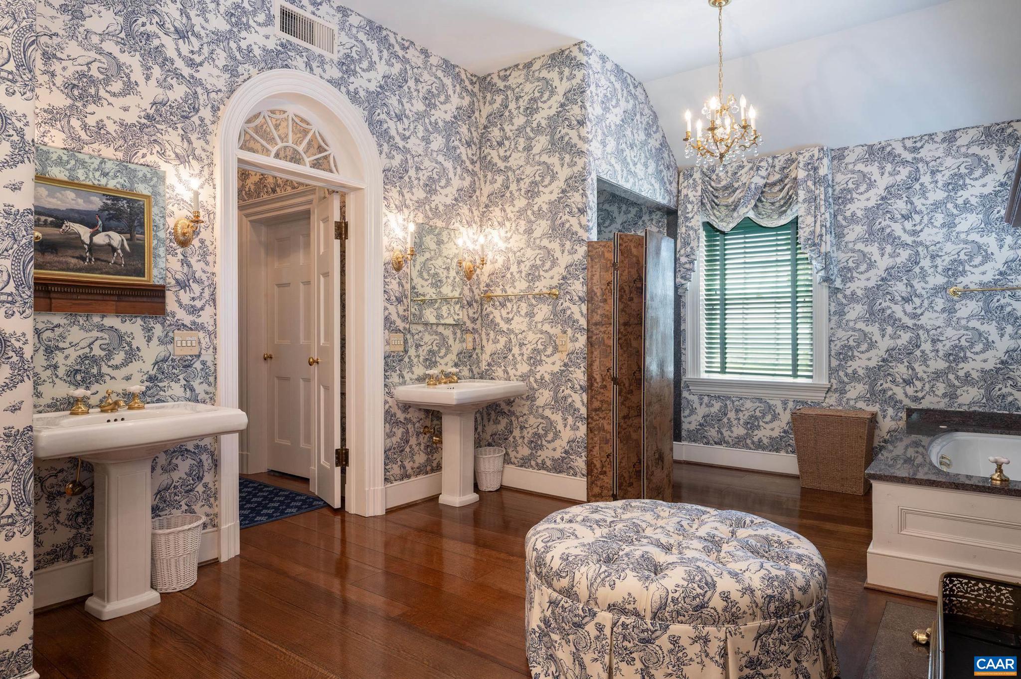 21515 Trappe Road Upperville, VA 20184 - Photo 27 of 75 a living room with furniture a fireplace and a chandelier
