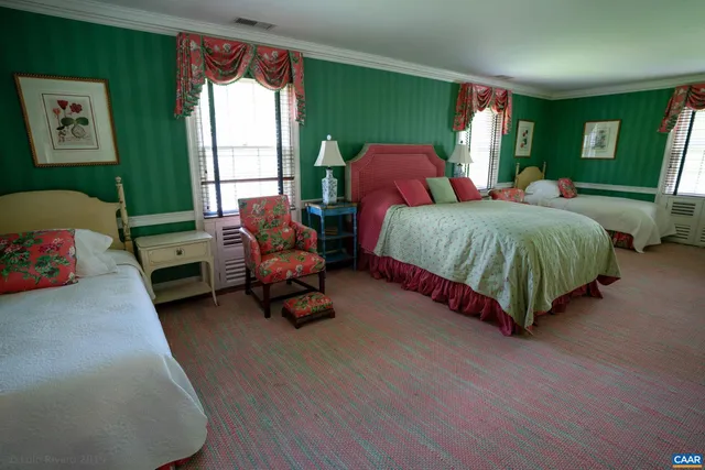 a view of an empty room with white walls