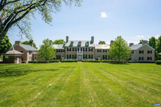 a view of a swimming pool with an outdoor seating