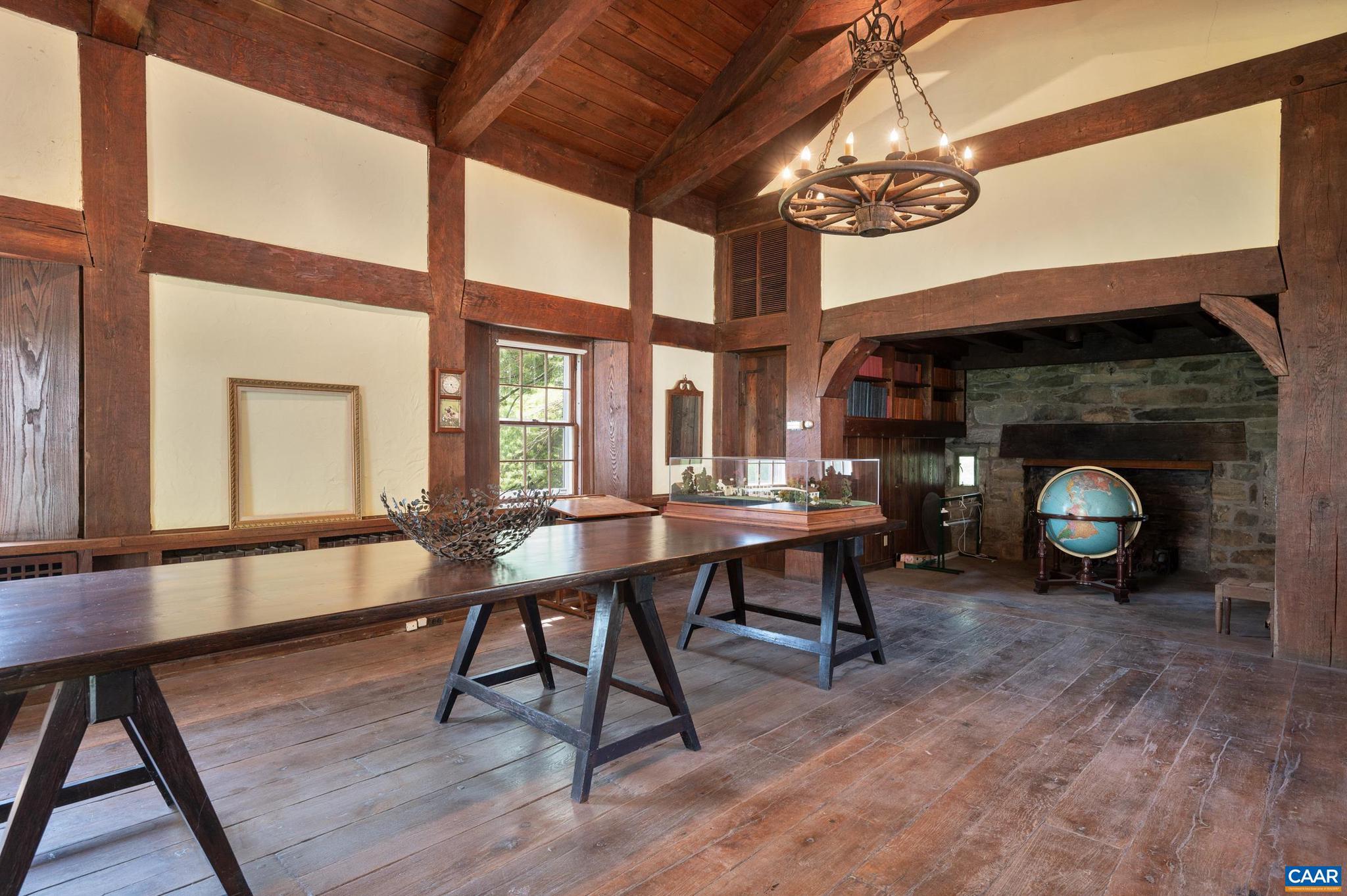 21515 Trappe Road Upperville, VA 20184 - Photo 40 of 75 a view of a dining room with furniture a chandelier and wooden floor