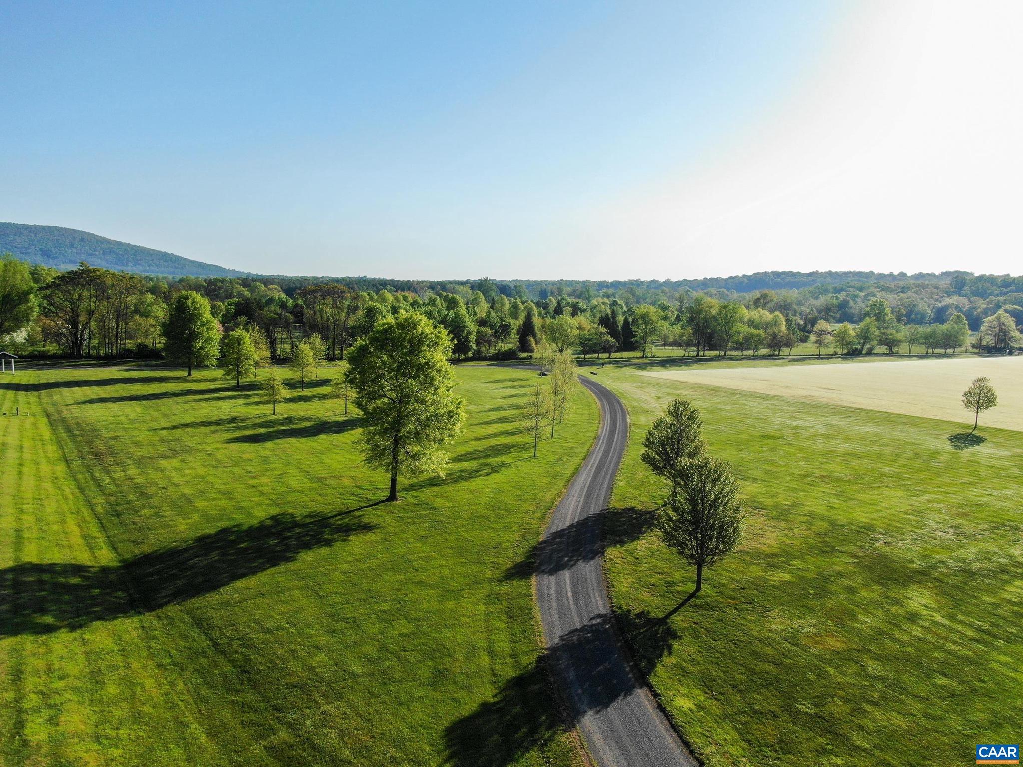 21515 Trappe Road Upperville, VA 20184 - Photo 51 of 75 a view of a lake with a big yard