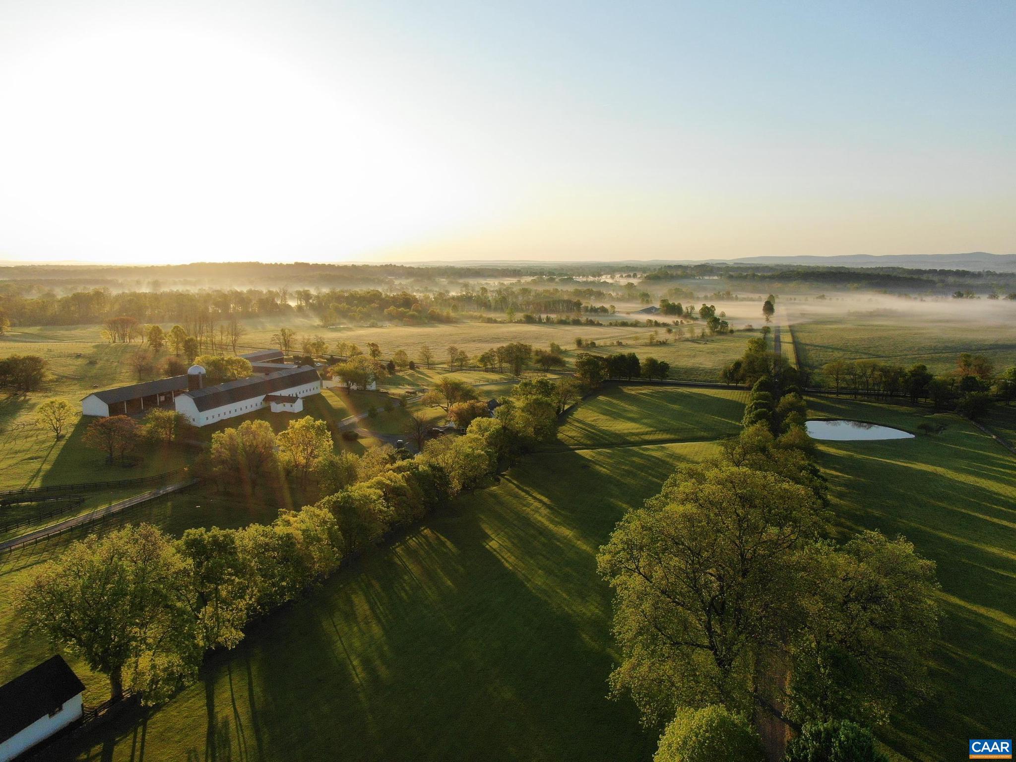 21515 Trappe Road Upperville, VA 20184 - Photo 68 of 75 a view of lake with lots of residential buildings and green space