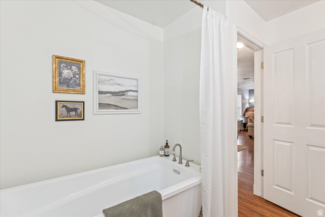 246 West Mount Charm Road Toquerville, UT 84774 - Photo 23 of 70 Full bathroom with a garden tub and wood finished floors
