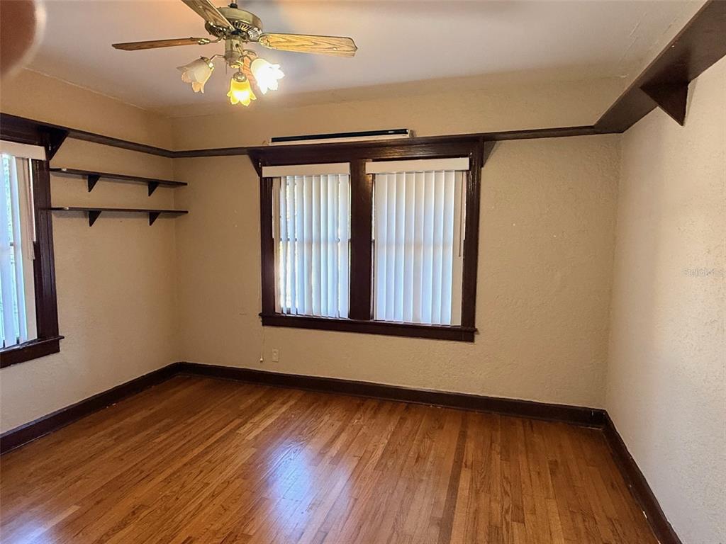 1908 20th Avenue North St. Petersburg, FL 33713 - Photo 14 of 39 a view of an empty room with wooden floor and a window