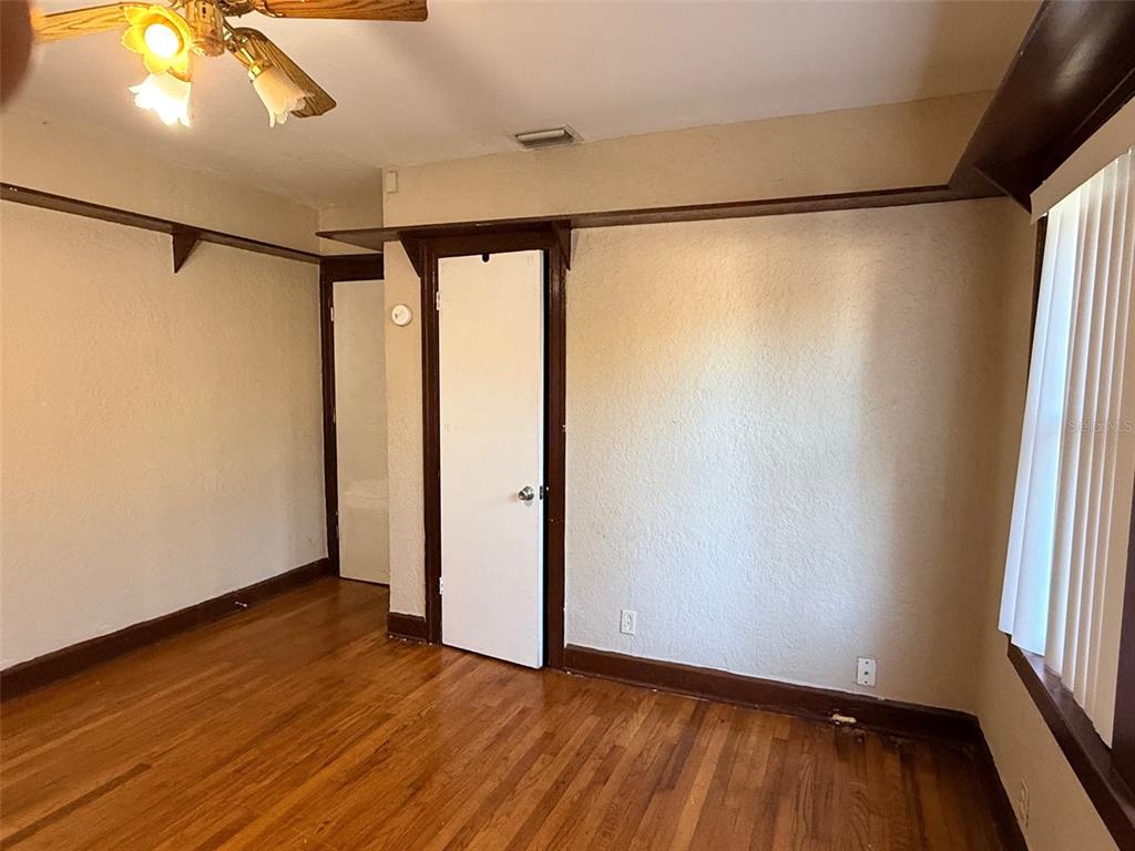 1908 20th Avenue North St. Petersburg, FL 33713 - Photo 17 of 39 a view of an empty room with wooden floor and a window