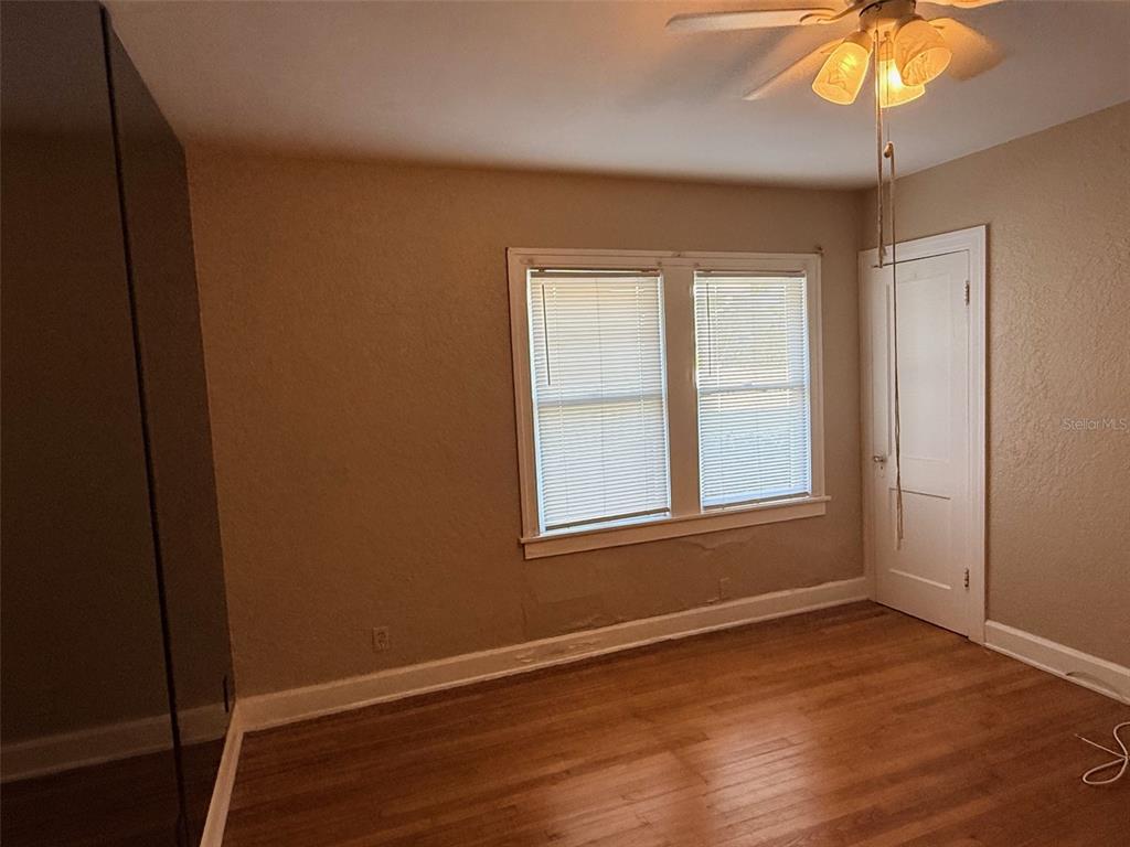 1908 20th Avenue North St. Petersburg, FL 33713 - Photo 21 of 39 a view of an empty room with wooden floor and a window