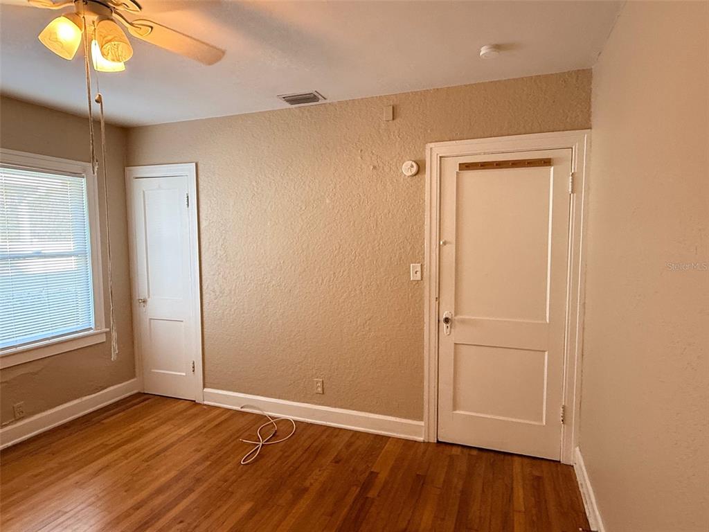 1908 20th Avenue North St. Petersburg, FL 33713 - Photo 22 of 39 an empty room with wooden floor and windows