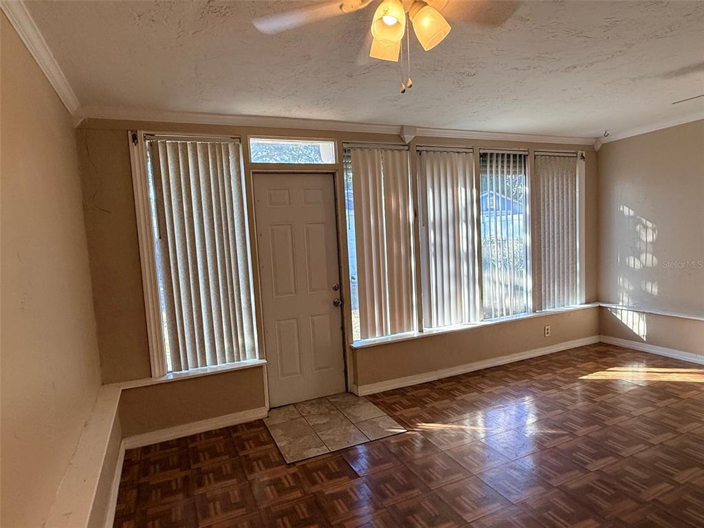 1908 20th Avenue North St. Petersburg, FL 33713 - Photo 25 of 39 a view of an empty room with a window and wooden floor