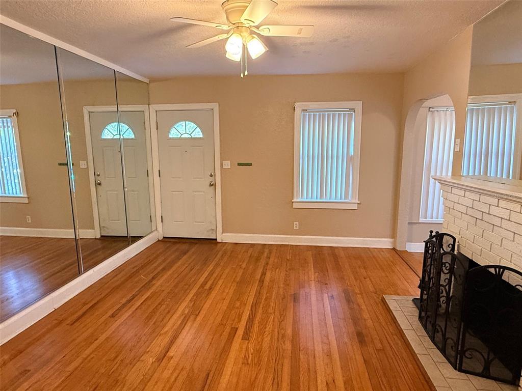 1908 20th Avenue North St. Petersburg, FL 33713 - Photo 3 of 39 a view of an empty room with wooden floor and a window