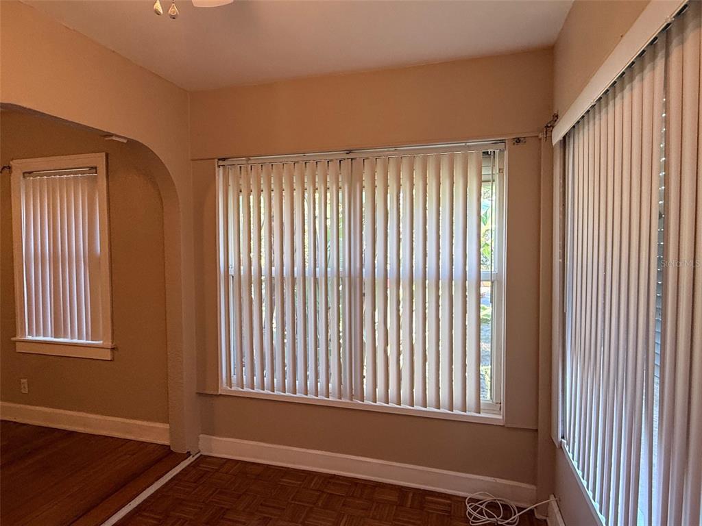 1908 20th Avenue North St. Petersburg, FL 33713 - Photo 31 of 39 an empty room with wooden floor and windows