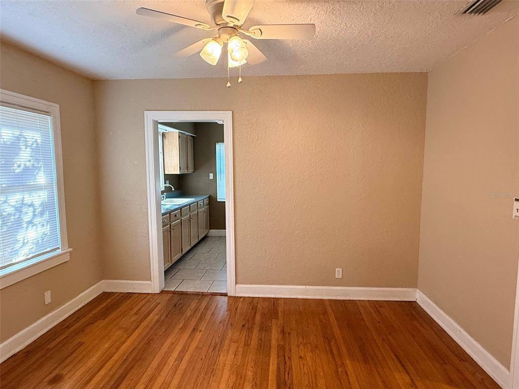 1908 20th Avenue North St. Petersburg, FL 33713 - Photo 6 of 39 wooden floor in an empty room with a window