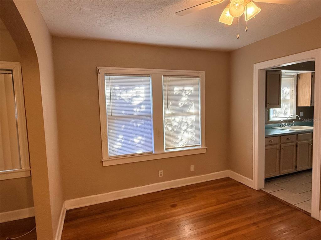 1908 20th Avenue North St. Petersburg, FL 33713 - Photo 7 of 39 a view of an empty room with a window and wooden floor