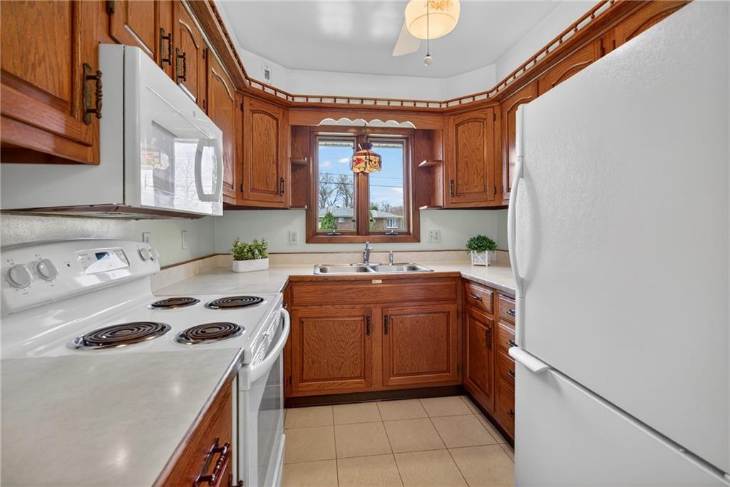 105 Clearview Drive Baden, PA 15005 - Photo 11 of 43 a kitchen that has a sink and a stove
