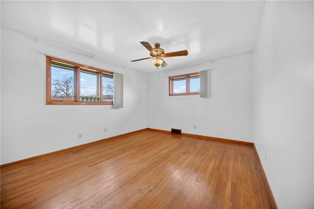 105 Clearview Drive Baden, PA 15005 - Photo 17 of 43 a view of a room with wooden floor and a ceiling fan