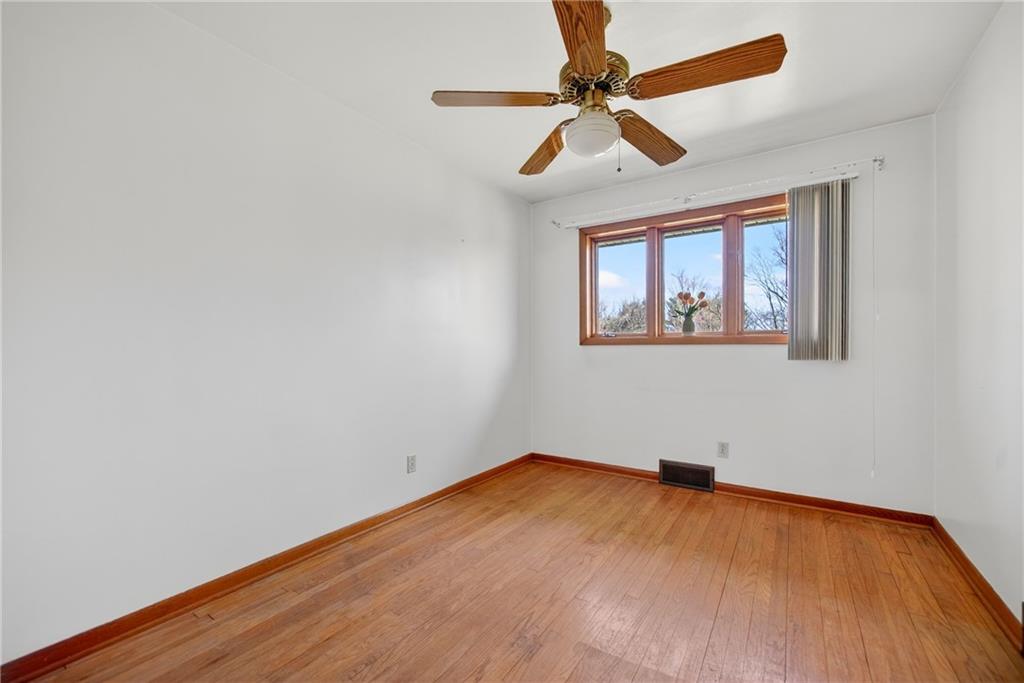 105 Clearview Drive Baden, PA 15005 - Photo 22 of 43 an empty room with a window and a ceiling fan