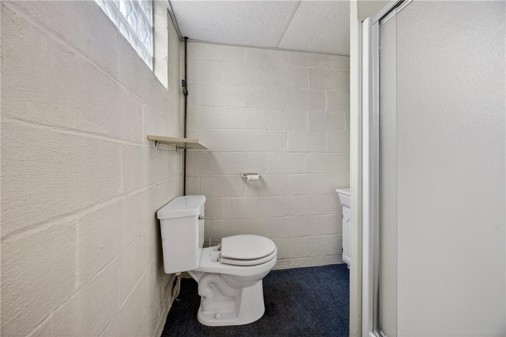 105 Clearview Drive Baden, PA 15005 - Photo 28 of 43 a white toilet sitting next to a shower
