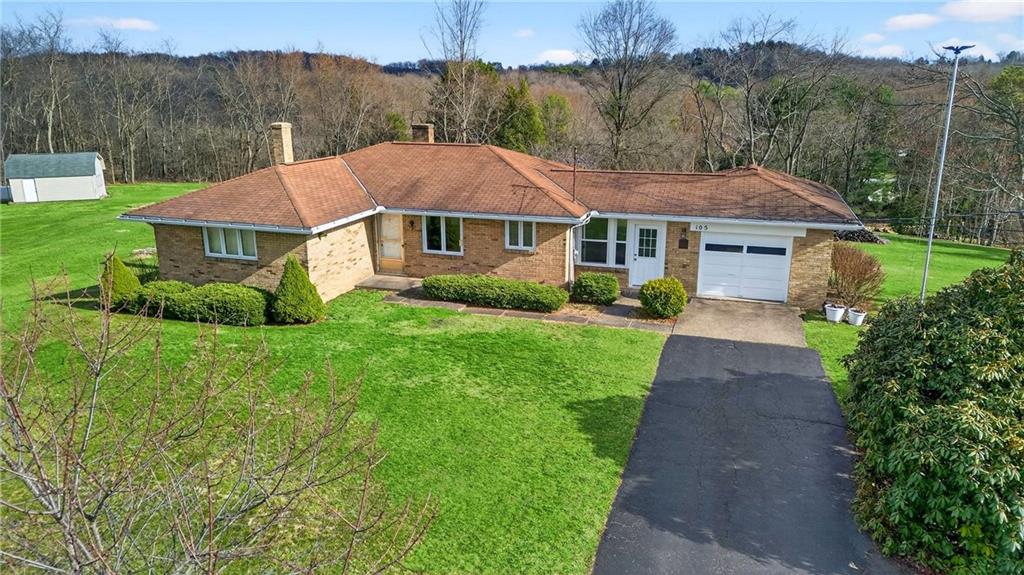 105 Clearview Drive Baden, PA 15005 - Photo 3 of 43 a view of a big house with a big yard plants and large trees