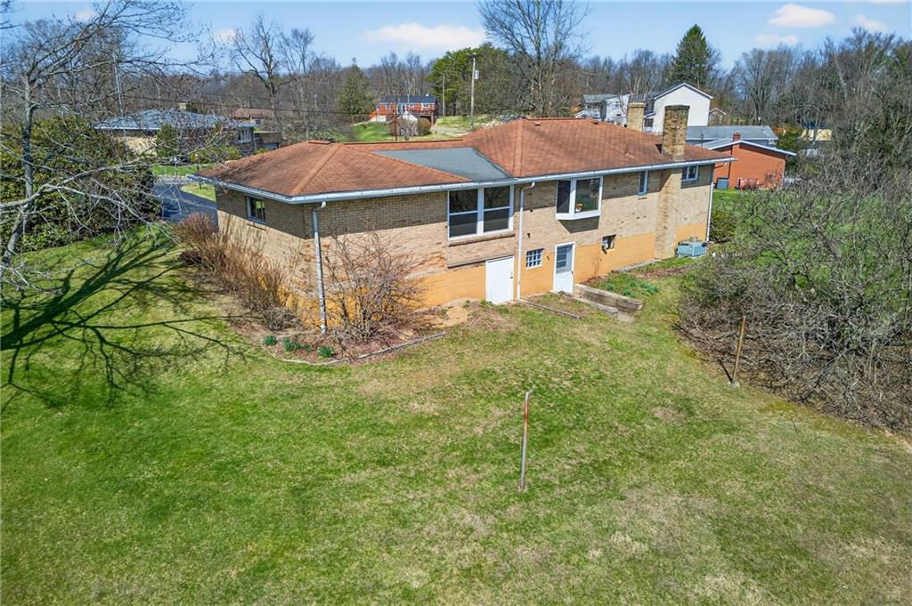 105 Clearview Drive Baden, PA 15005 - Photo 33 of 43 an aerial view of a house with garden space and trees