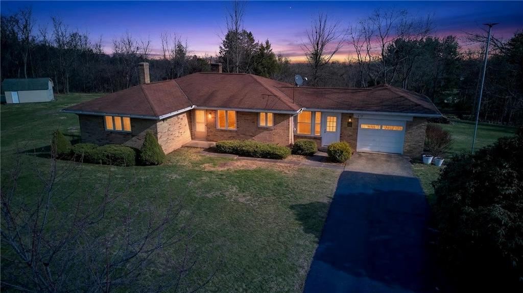 105 Clearview Drive Baden, PA 15005 - Photo 4 of 43 a front view of a house with a yard and trees