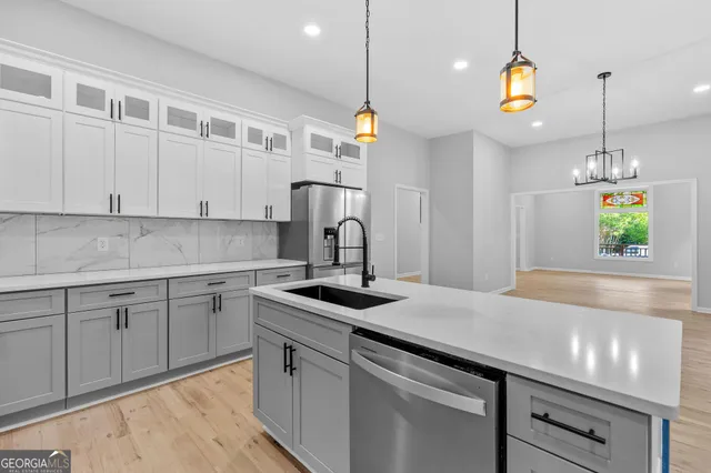 a kitchen with a sink cabinets and window