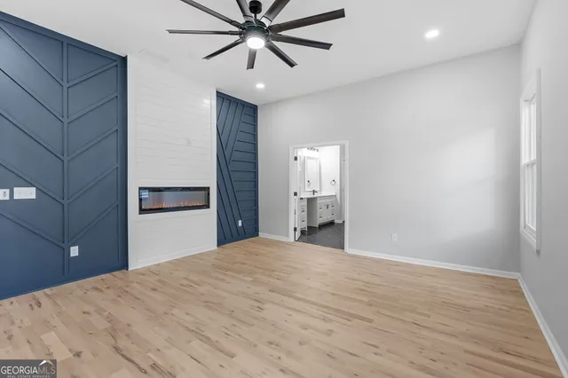 a view of a big room with wooden floor and closet