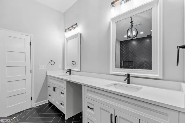 a bathroom with a sink and mirror with window