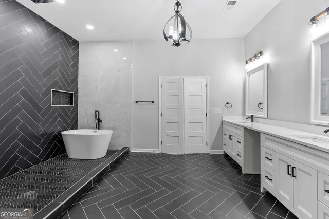 a bathroom with a double vanity sink a toilet and shower