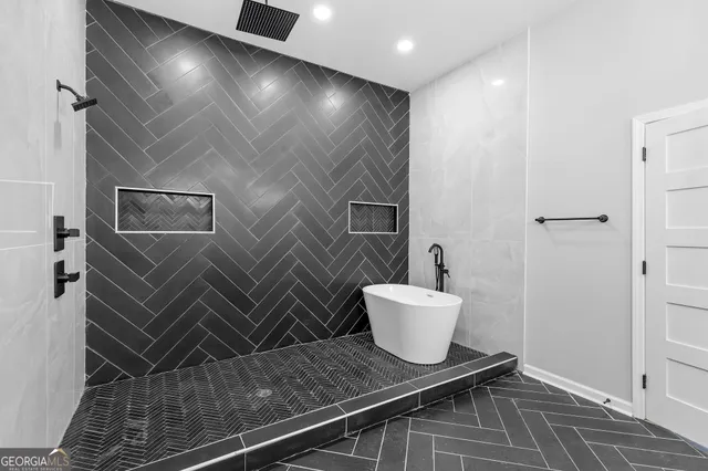 a bathroom with a sink and mirror