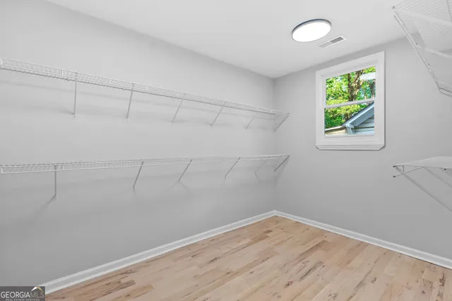 a view of a room that has a window in it