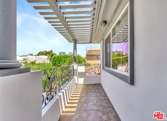 a view of balcony with furniture