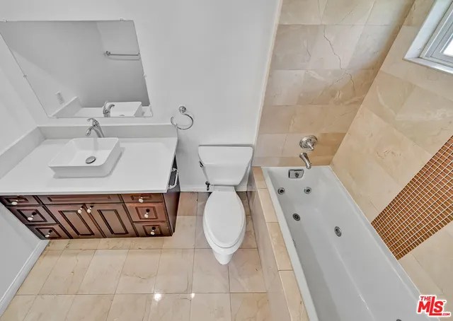 a bathroom with a bathtub and a sink