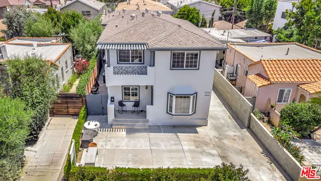 a aerial view of a house with garden and plants