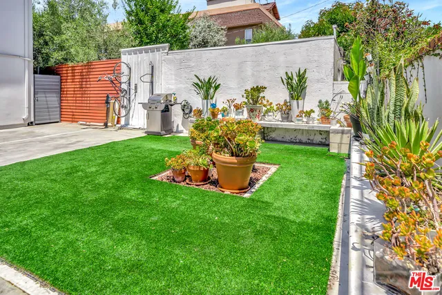 a garden view with a seating space