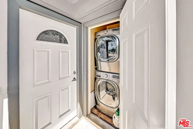 a view of a hallway with washer and dryer